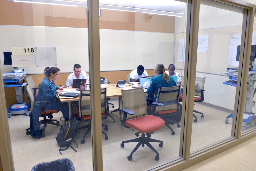 Healthcare students study together in a conference room